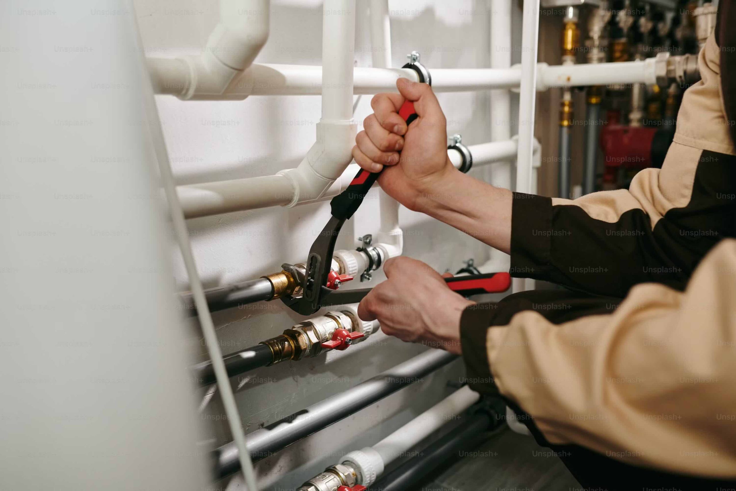 Plumber working on a residential emergency service call